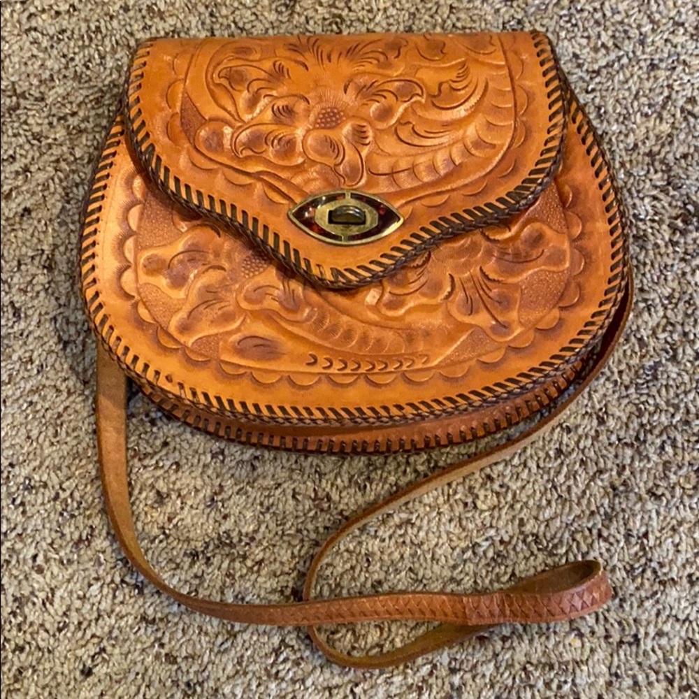 Vintage leather shoulder bag w/ hand-carved motif